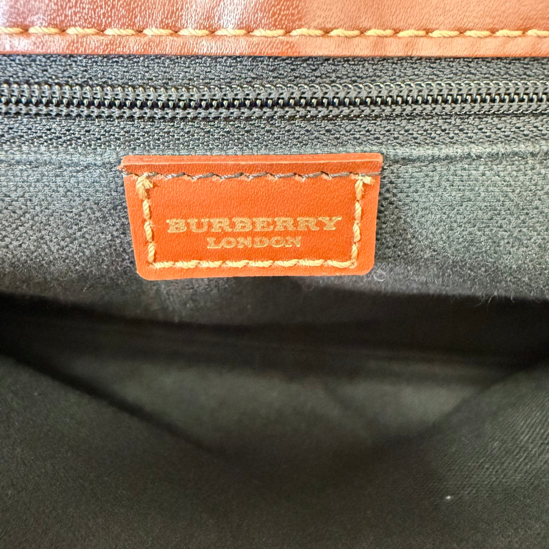 Luxe Vault interior view of a Burberry London leather brand tag inside a dark brown tote bag