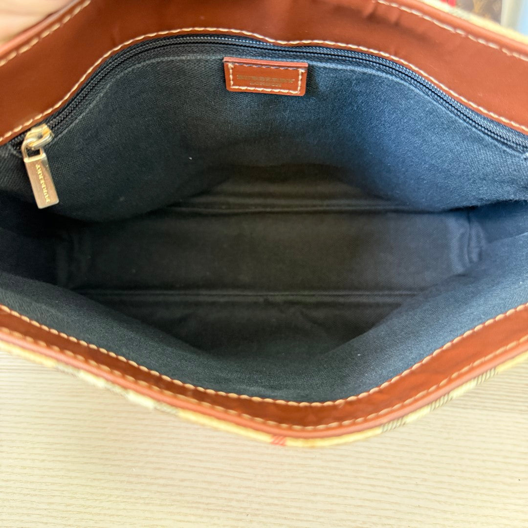 Luxe Vault Burberry House Check tote interior featuring dark brown leather trim and black fabric lining
