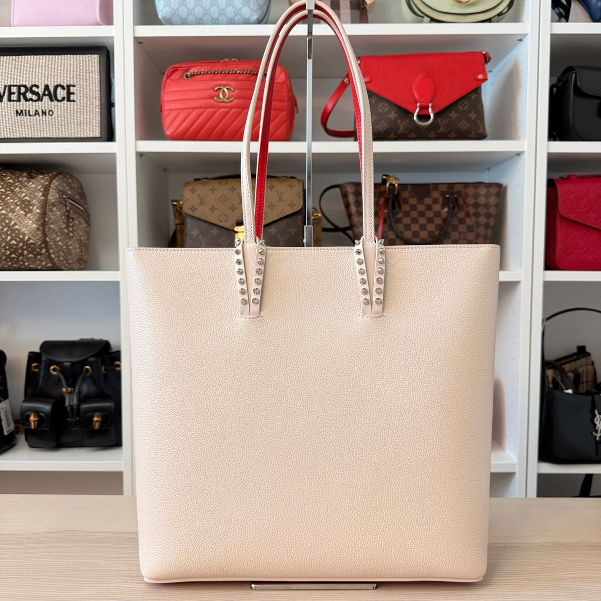 Luxe Vault Christian Louboutin Cabata North South tote in milk white leather with signature red handle lining