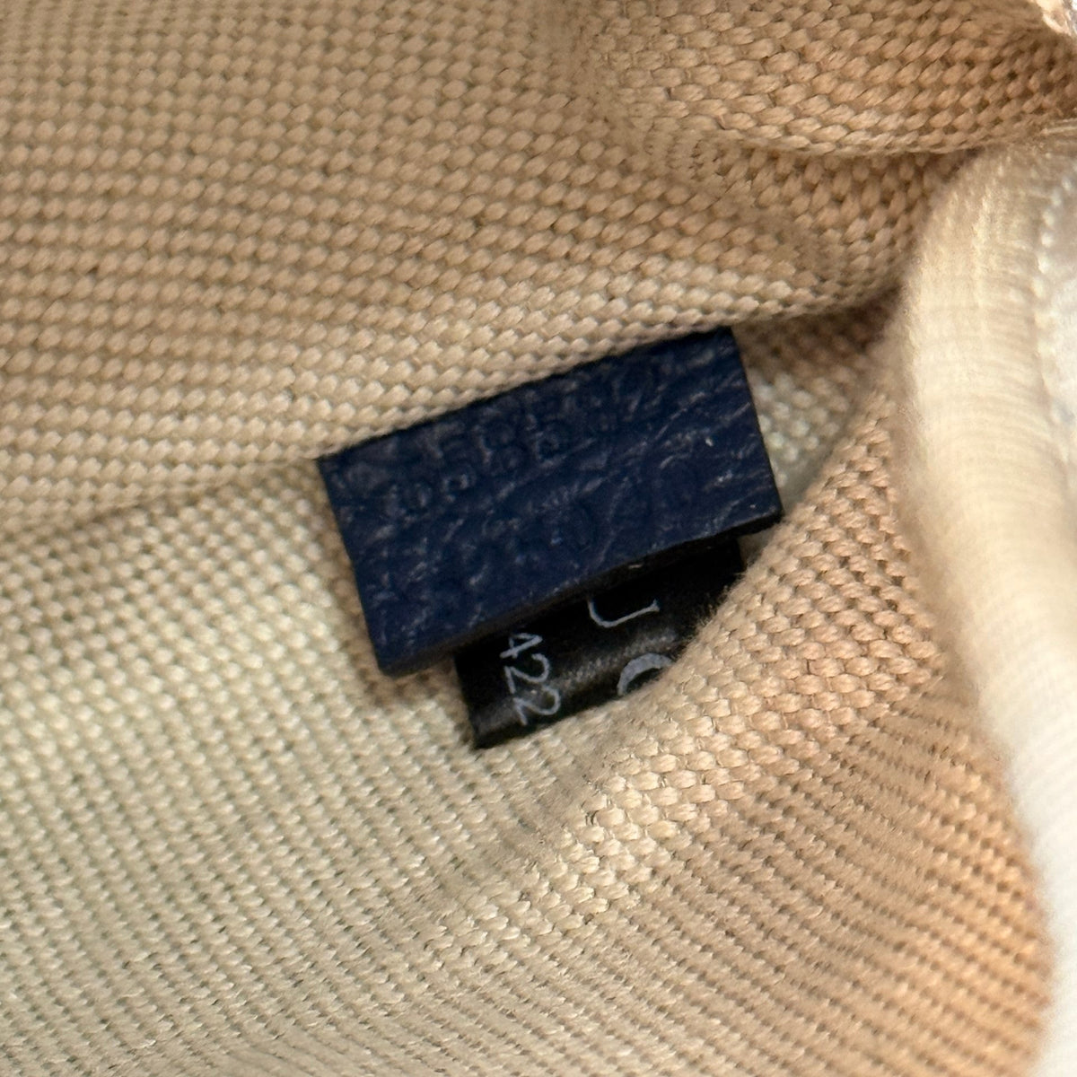 Luxe Vault Gucci Jumbo GG embossed leather belt bag interior authenticity tag and serial number detail