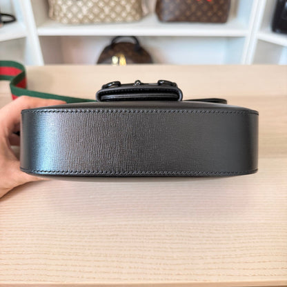 Luxe Vault Gucci Monochrome Horsebit 1955 shoulder bag in black leather, showing the side profile and base.