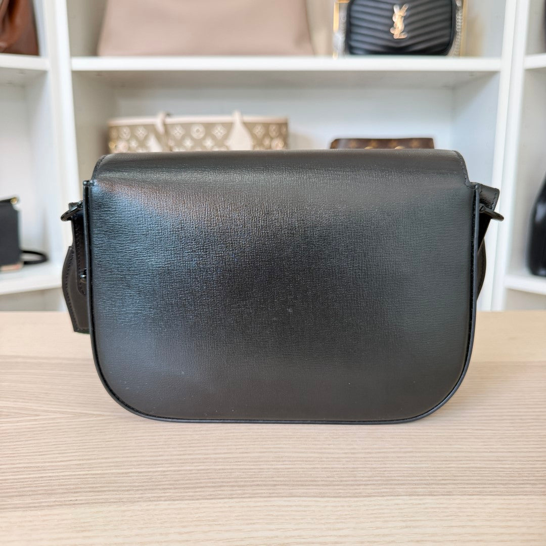 Luxe Vault Gucci Monochrome Horsebit 1955 shoulder bag in black leather, back view showing smooth texture.