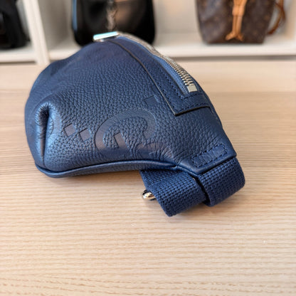 Luxe Vault blue Gucci Jumbo GG embossed leather belt bag with silver hardware and adjustable strap