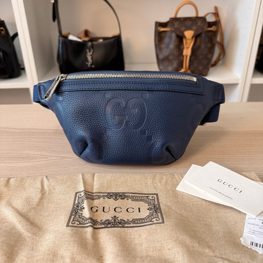 Luxe Vault blue Gucci Jumbo GG embossed leather belt bag with silver hardware, shown with dustbag and tags.