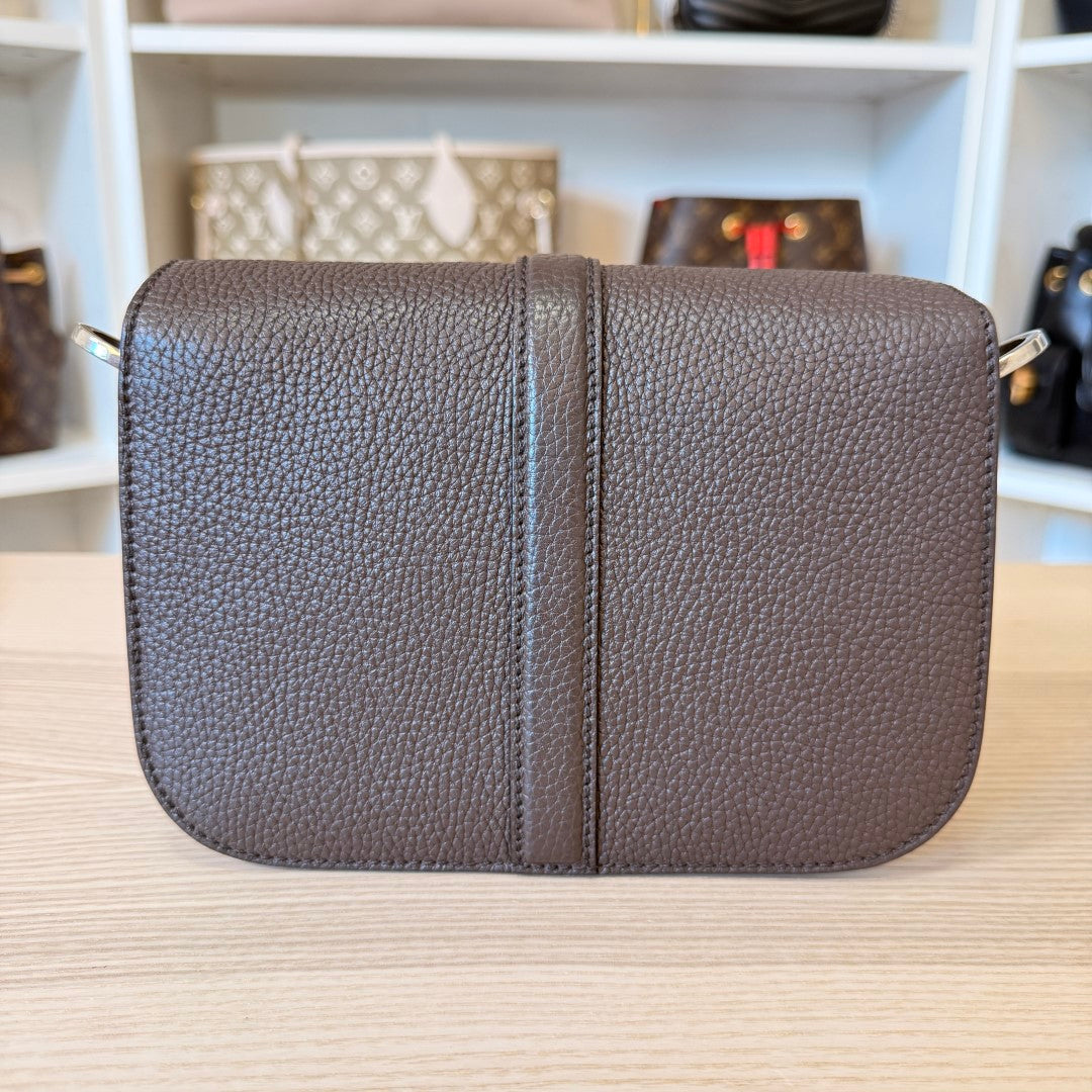 Luxe Vault pre-owned Gucci mini crossbody bag in brown pebbled leather with a flap closure and silver hardware.