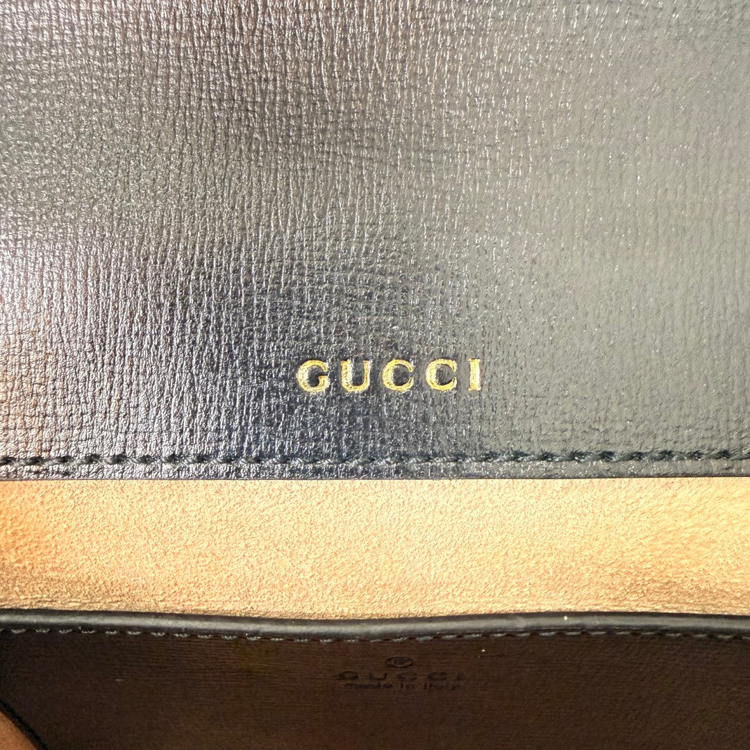 Luxe Vault Gucci Monochrome Horsebit 1955 shoulder bag interior featuring gold embossed logo on black leather