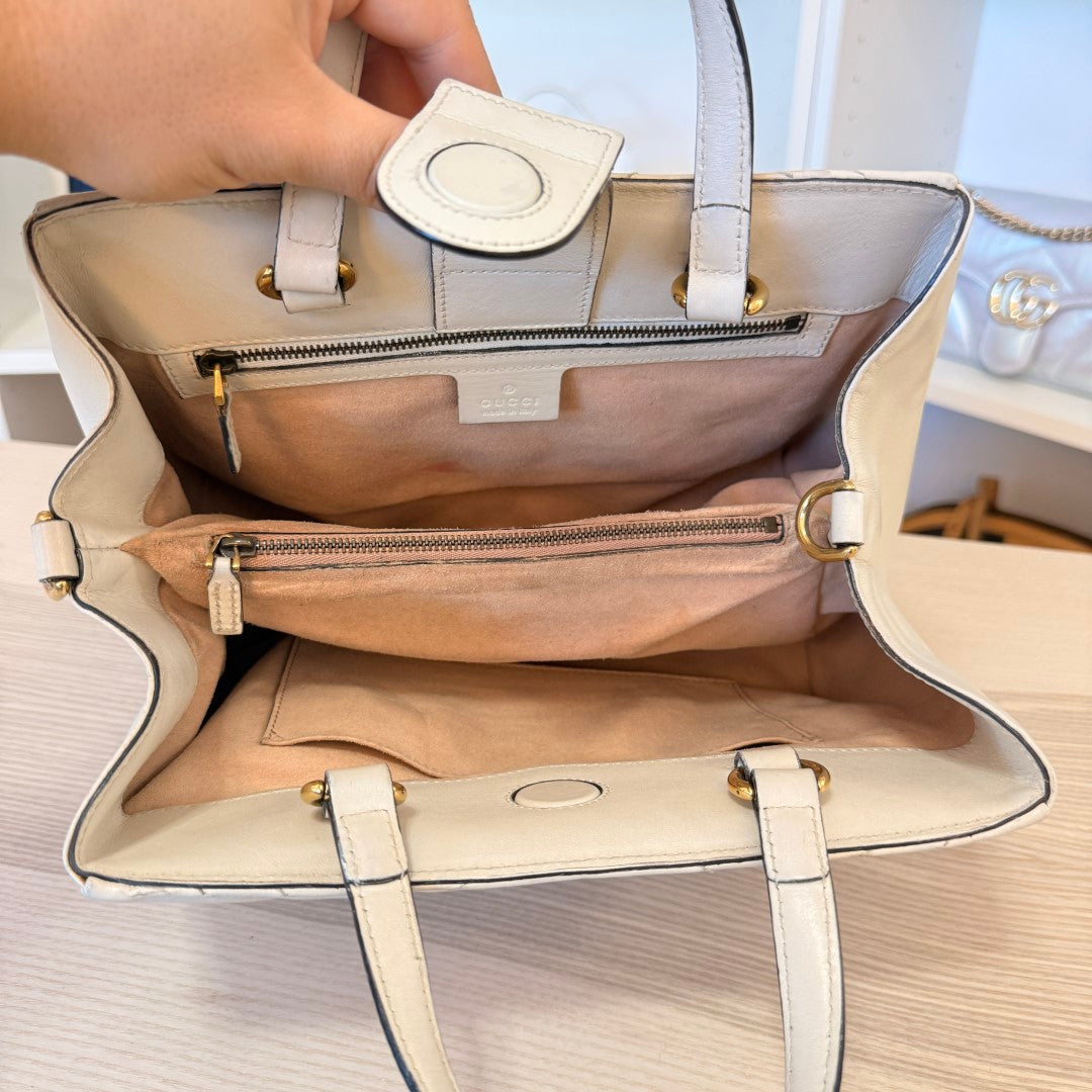 Luxe Vault pre-owned white Gucci GG Marmont matelasse calfskin tote bag interior view with zip pocket and magnet closure