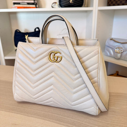 Luxe Vault white Gucci GG Marmont small tote bag in chevron matelasse calfskin leather with gold-tone hardware.