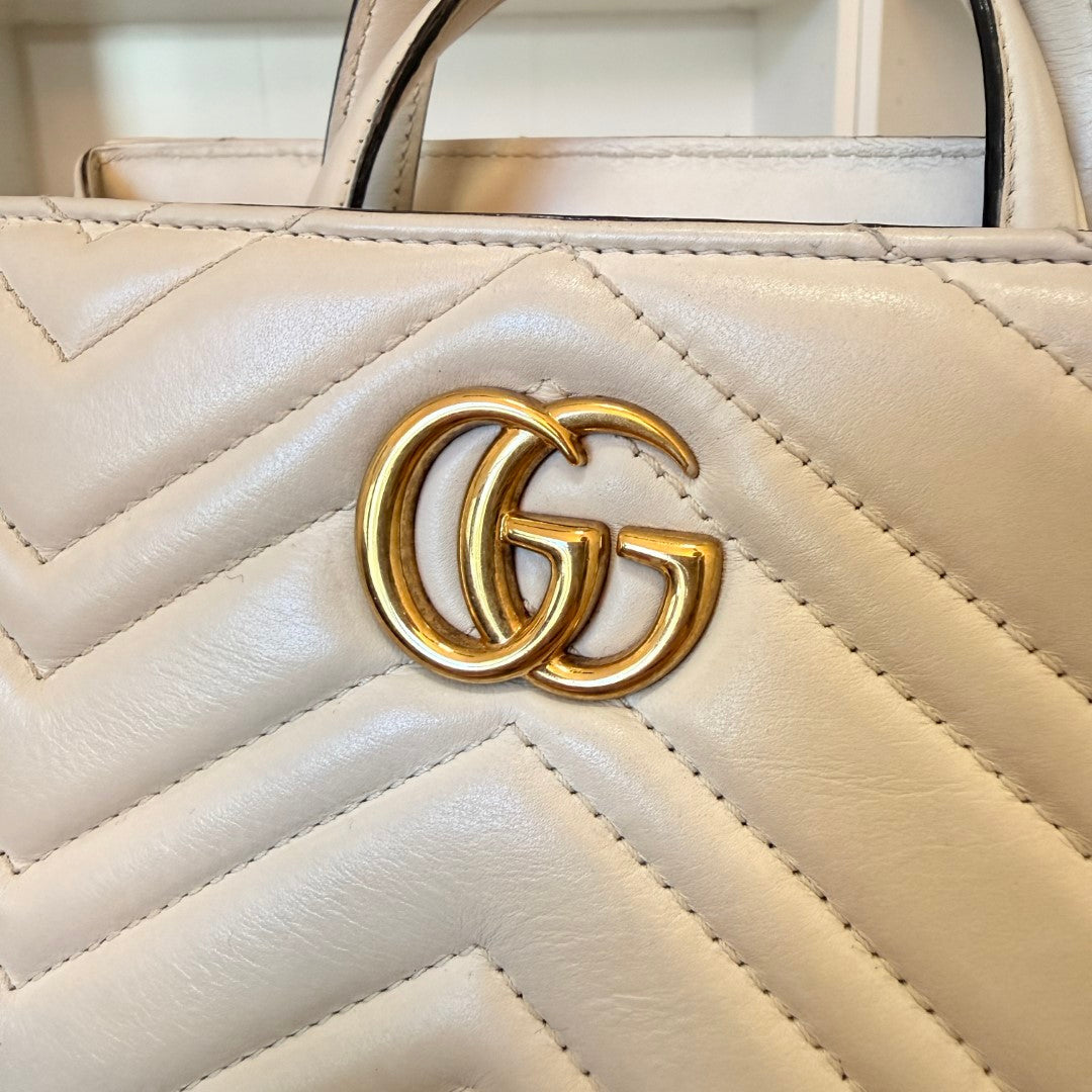 Luxe Vault white matelasse calfskin Gucci GG Marmont small tote bag with gold-tone GG logo hardware