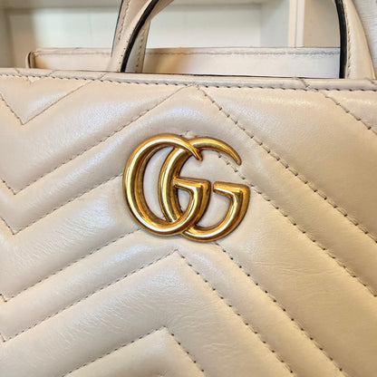 Luxe Vault white matelasse calfskin Gucci GG Marmont small tote bag with gold-tone GG logo hardware