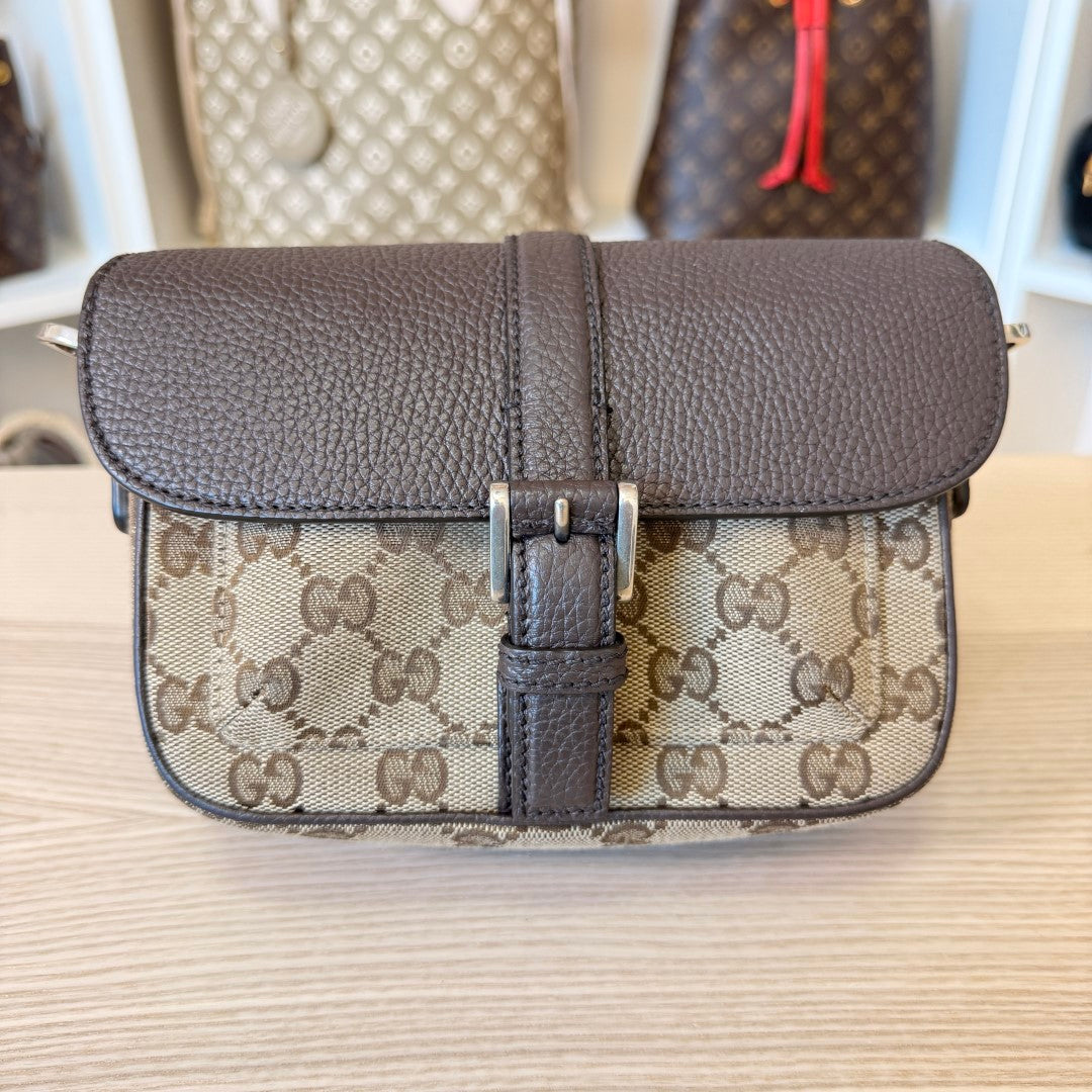 Luxe Vault Gucci monogram canvas and brown leather mini crossbody bag with a front buckle closure