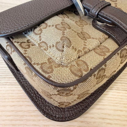 Luxe Vault Gucci monogram mini crossbody bag featuring brown leather trim and classic canvas pattern