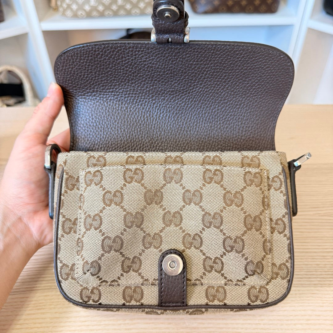 Luxe Vault pre-owned Gucci monogram canvas mini crossbody bag with brown leather trim and snap button closure