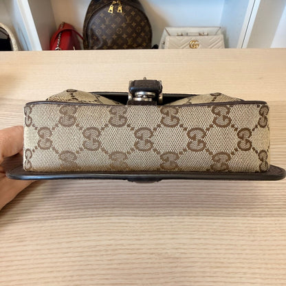 Luxe Vault Gucci monogram canvas mini crossbody bag base view showing brown leather trim and metal hardware