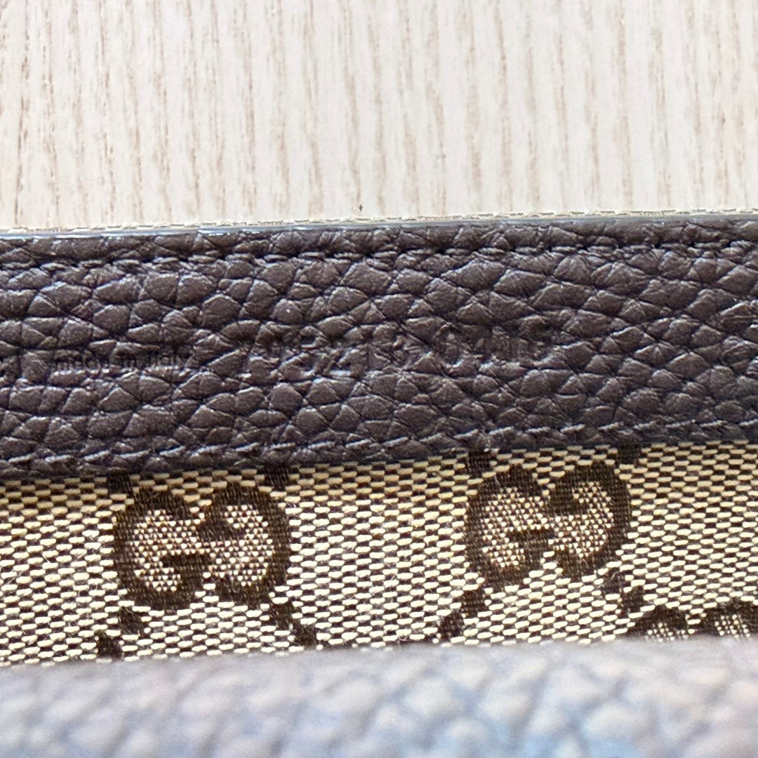 Luxe Vault Gucci monogram canvas and brown leather interior detail with embossed logo stamp