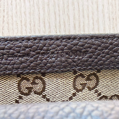 Luxe Vault Gucci monogram canvas and brown leather interior detail with embossed logo stamp