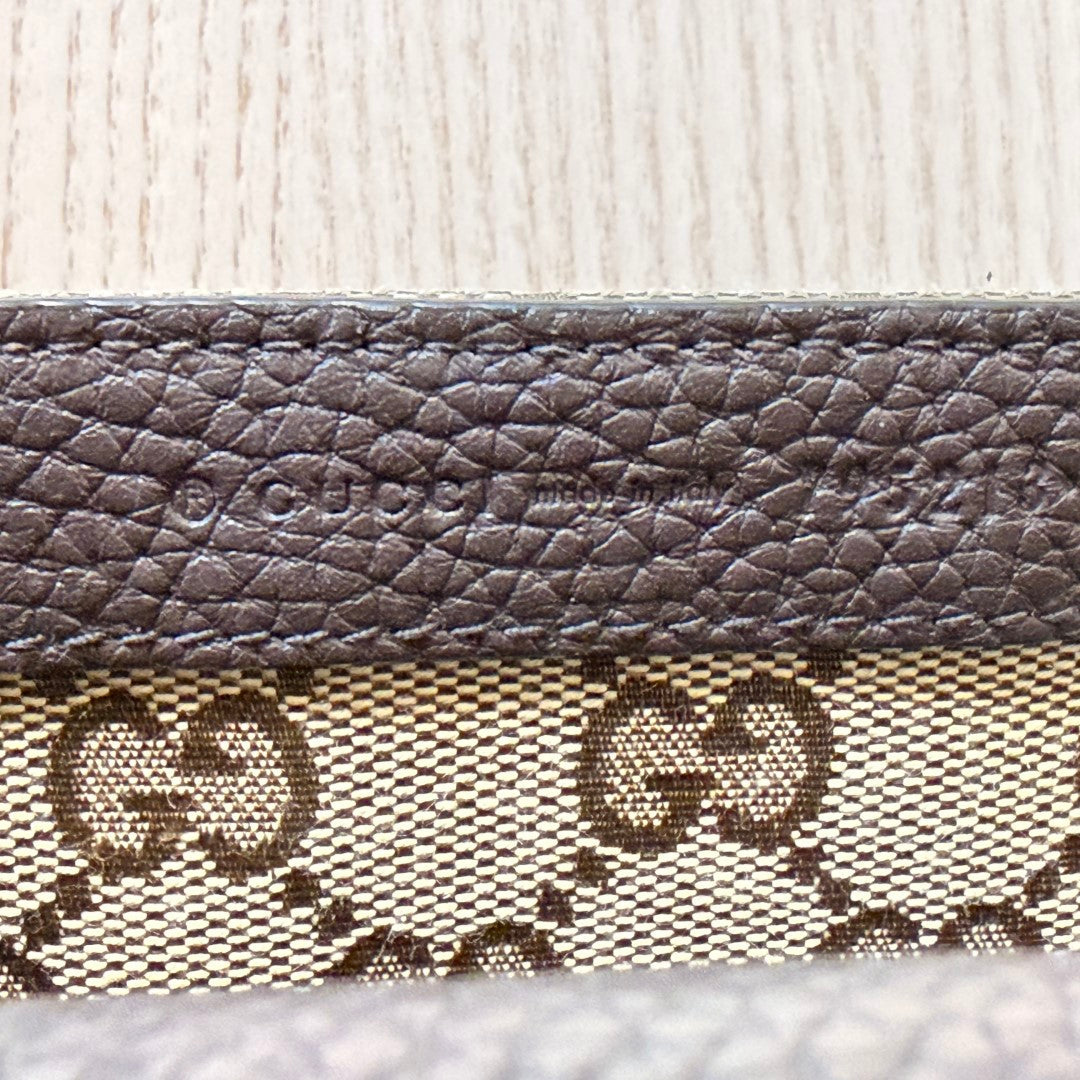Luxe Vault Gucci monogram canvas and brown leather interior detail with embossed logo