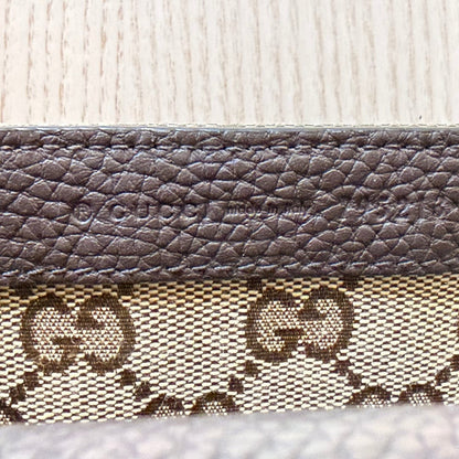 Luxe Vault Gucci monogram canvas and brown leather interior detail with embossed logo