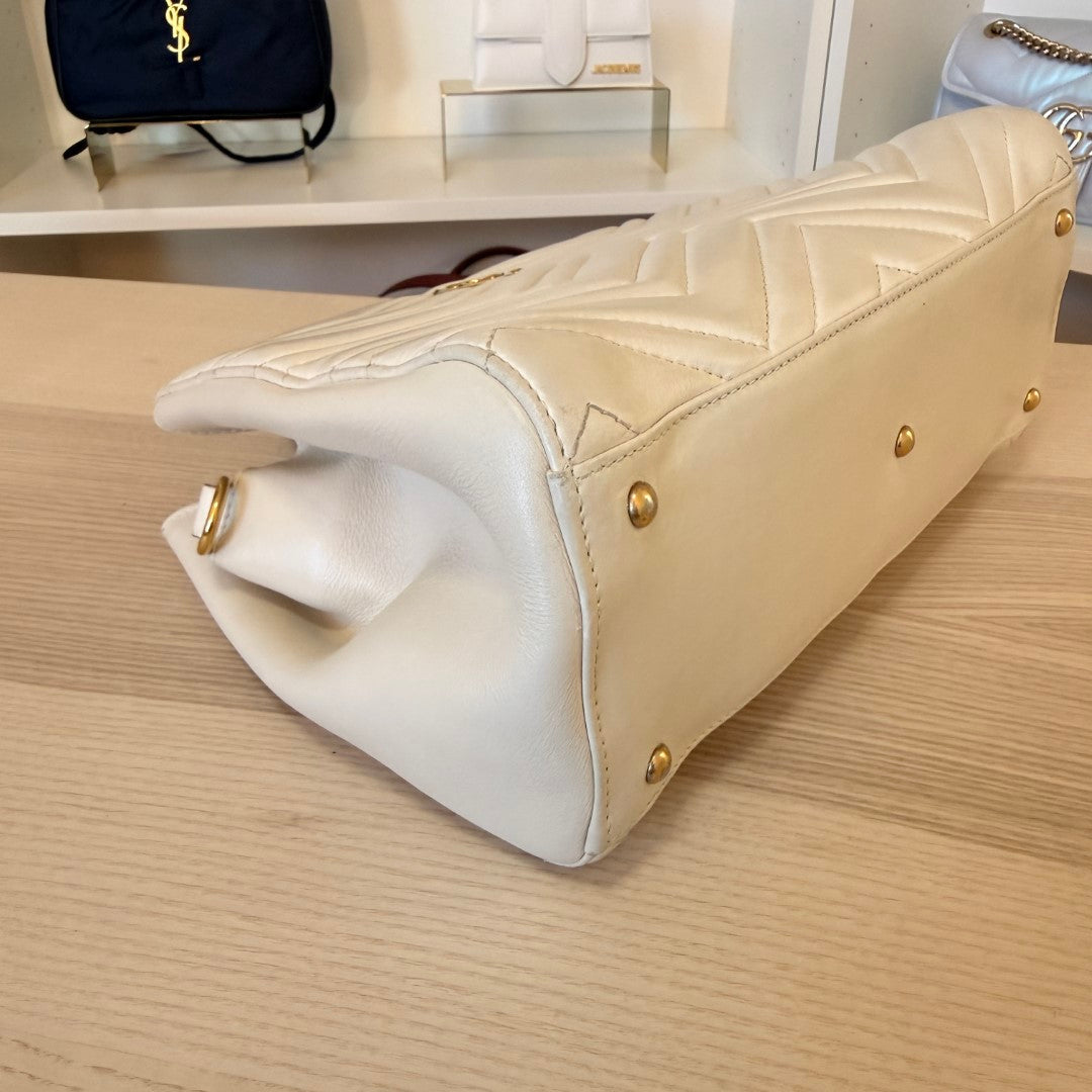 Luxe Vault white Gucci GG Marmont matelasse calfskin tote bag showing base with protective gold-tone metal feet