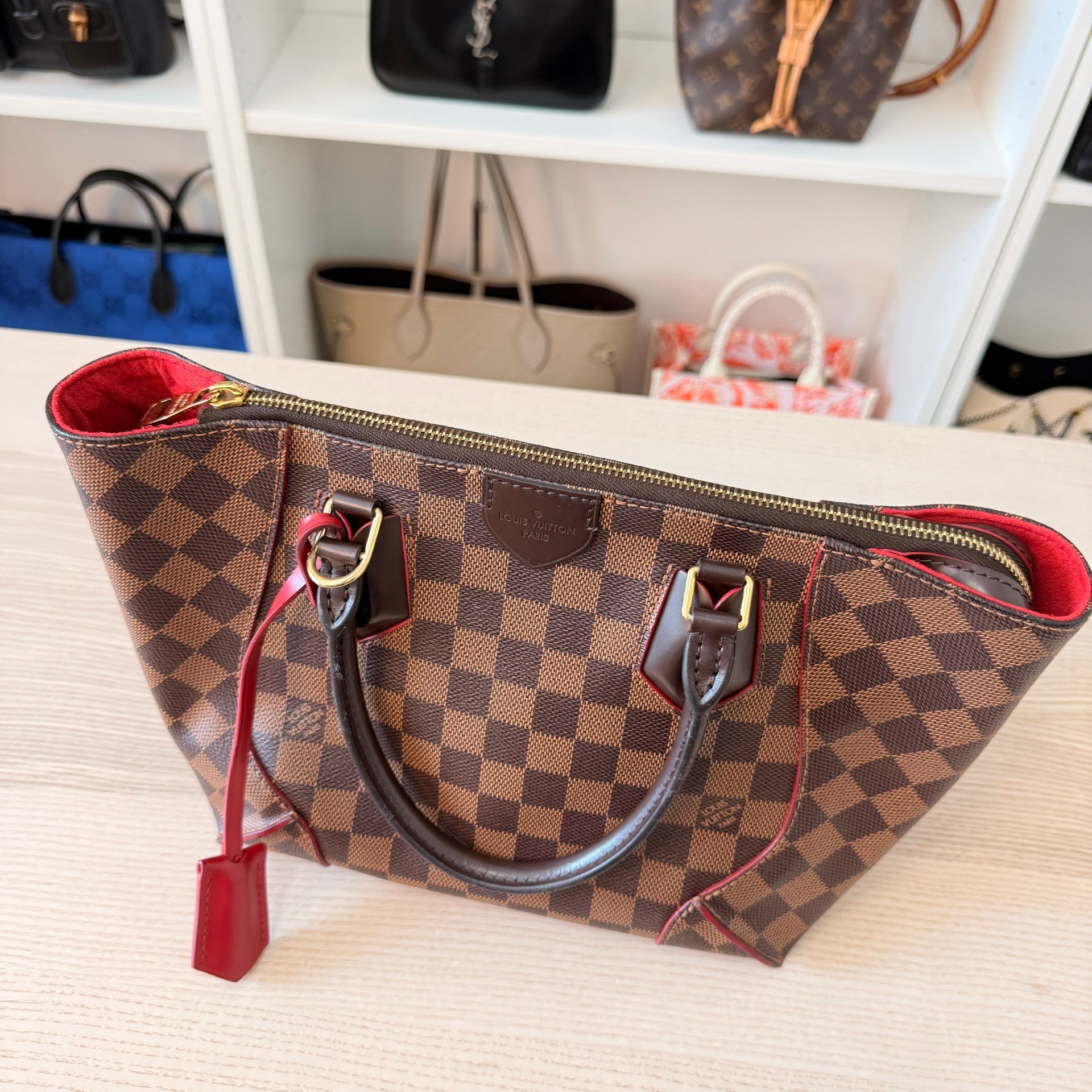 Luxe Vault Louis Vuitton Caissa PM handbag in Damier Ebene canvas with brown leather handles and red interior lining