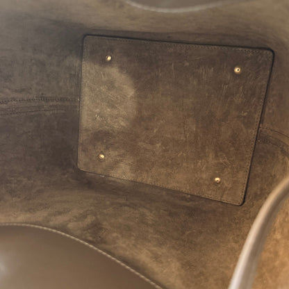 Interior view of Luxe Vault Saint Laurent Le 37 bucket bag in deep musk suede with protective metal feet