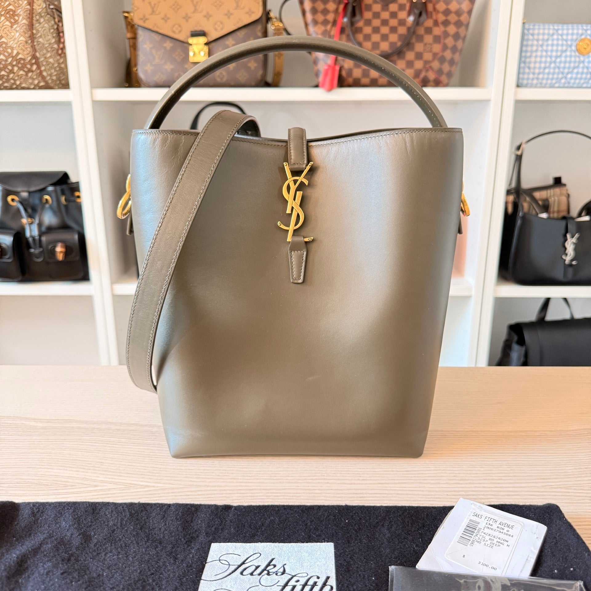Luxe Vault Saint Laurent Le 37 bucket bag in deep musk shiny calfskin with gold YSL logo hardware and adjustable strap